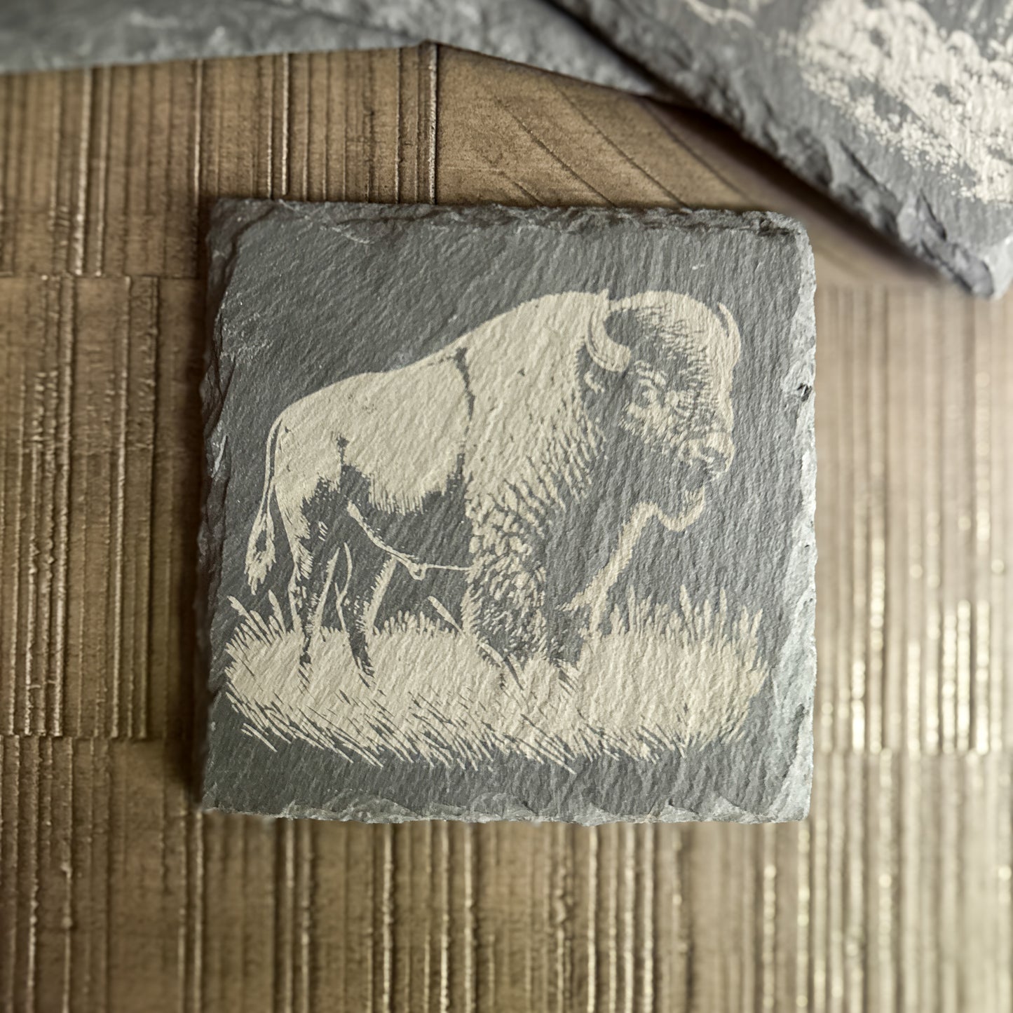 Engraved slate coaster with bison grazing in grass – Western rustic wildlife drinkware