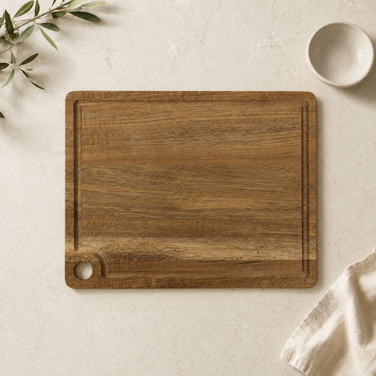 Front of acacia cutting board with juice groove and corner hanging hole