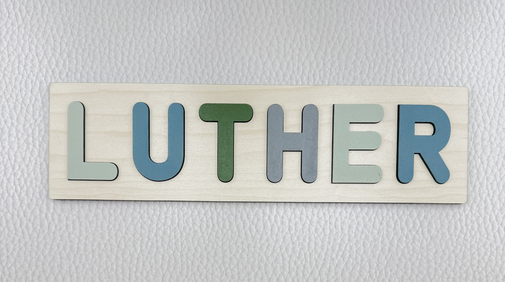 Personalized wooden name puzzle fully assembled with colorful letters – handmade toddler gift