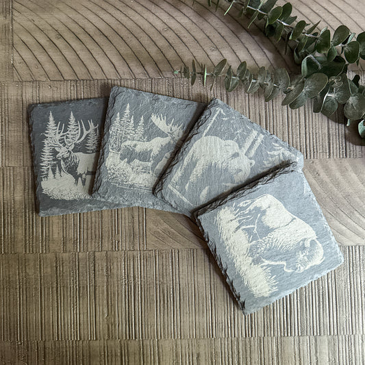 Set of 4 wildlife slate coasters with engraved elk, moose, grizzly bear, and bison – rustic cabin or lodge decor